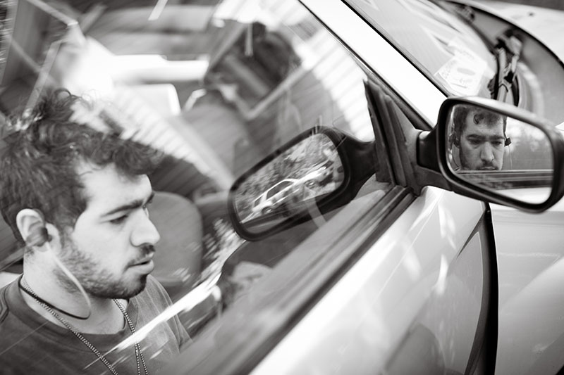 man fixing car portrait