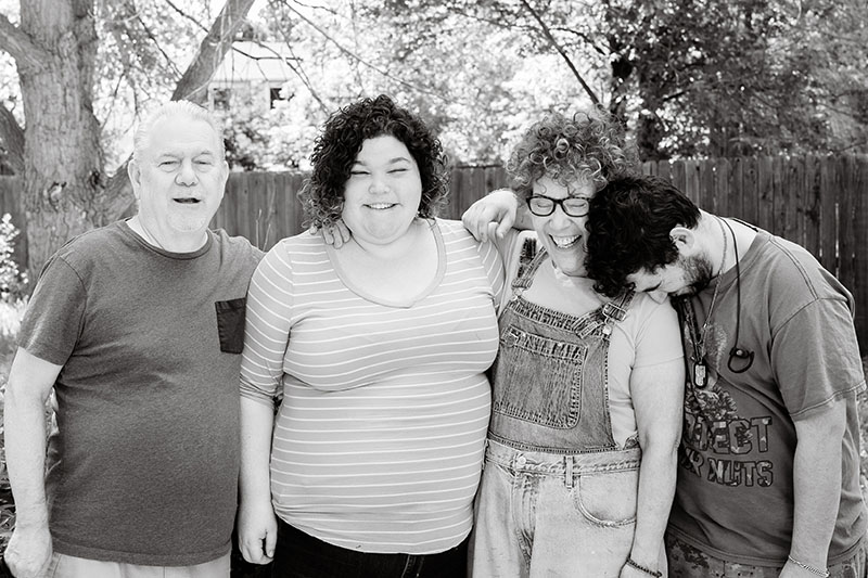 family hugging and laughing