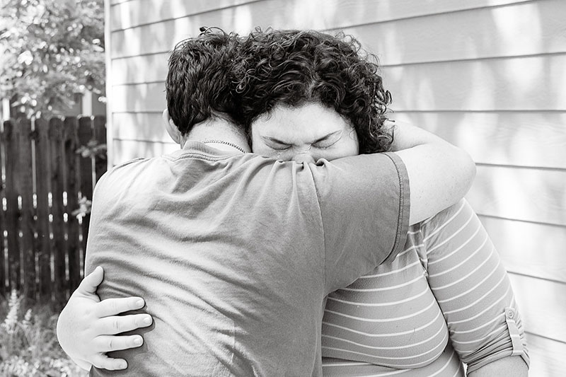 brother and sister crying at a farewell