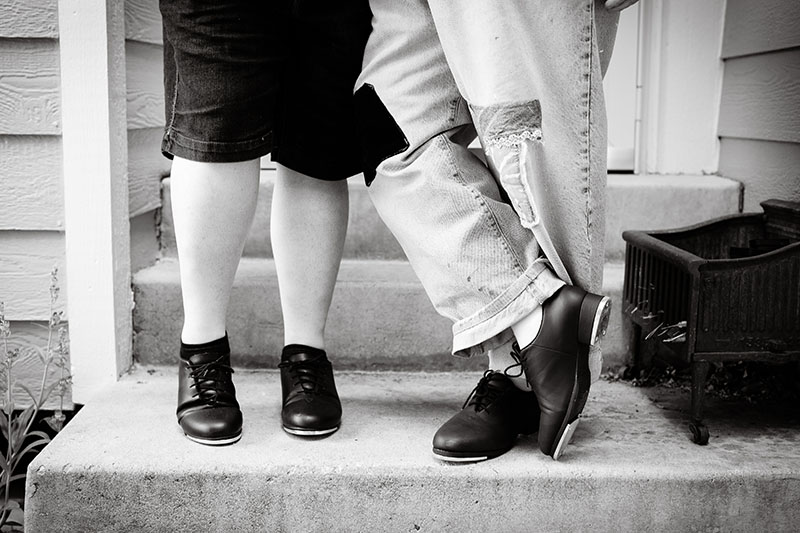 mom and daughters legs with tap shoes