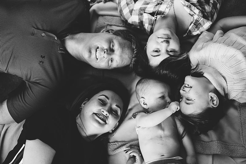 family portraits lying on floor on backs