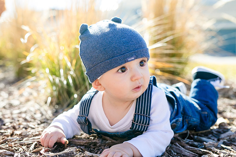 baby outside in a hat photography