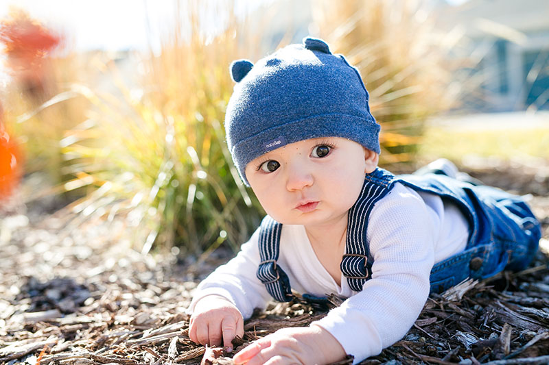 baby outside in a hat photography