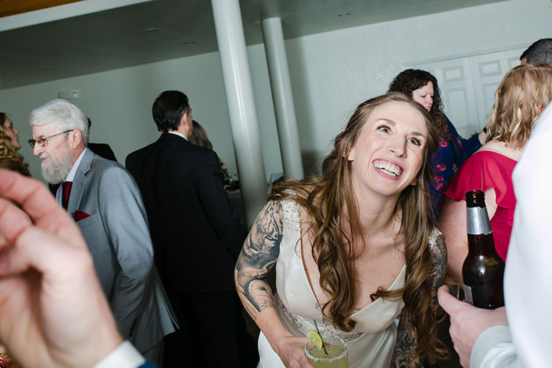 bride laughing at her wedding