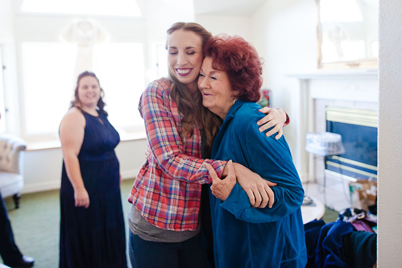 Bride hugging mom at wedding