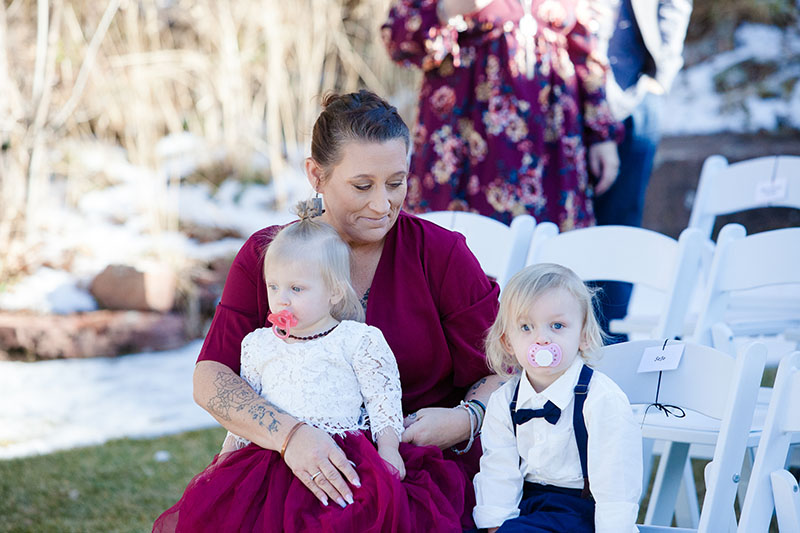 Two kids at wedding ceremony