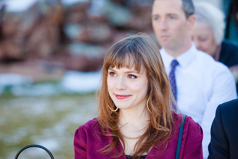 guest watching bride during ceremony at wedding