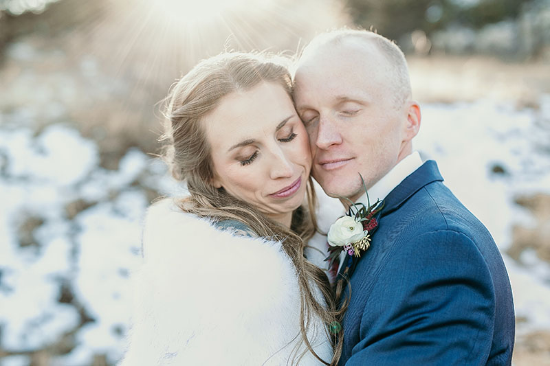 bride and groom cheek to cheek at wedding