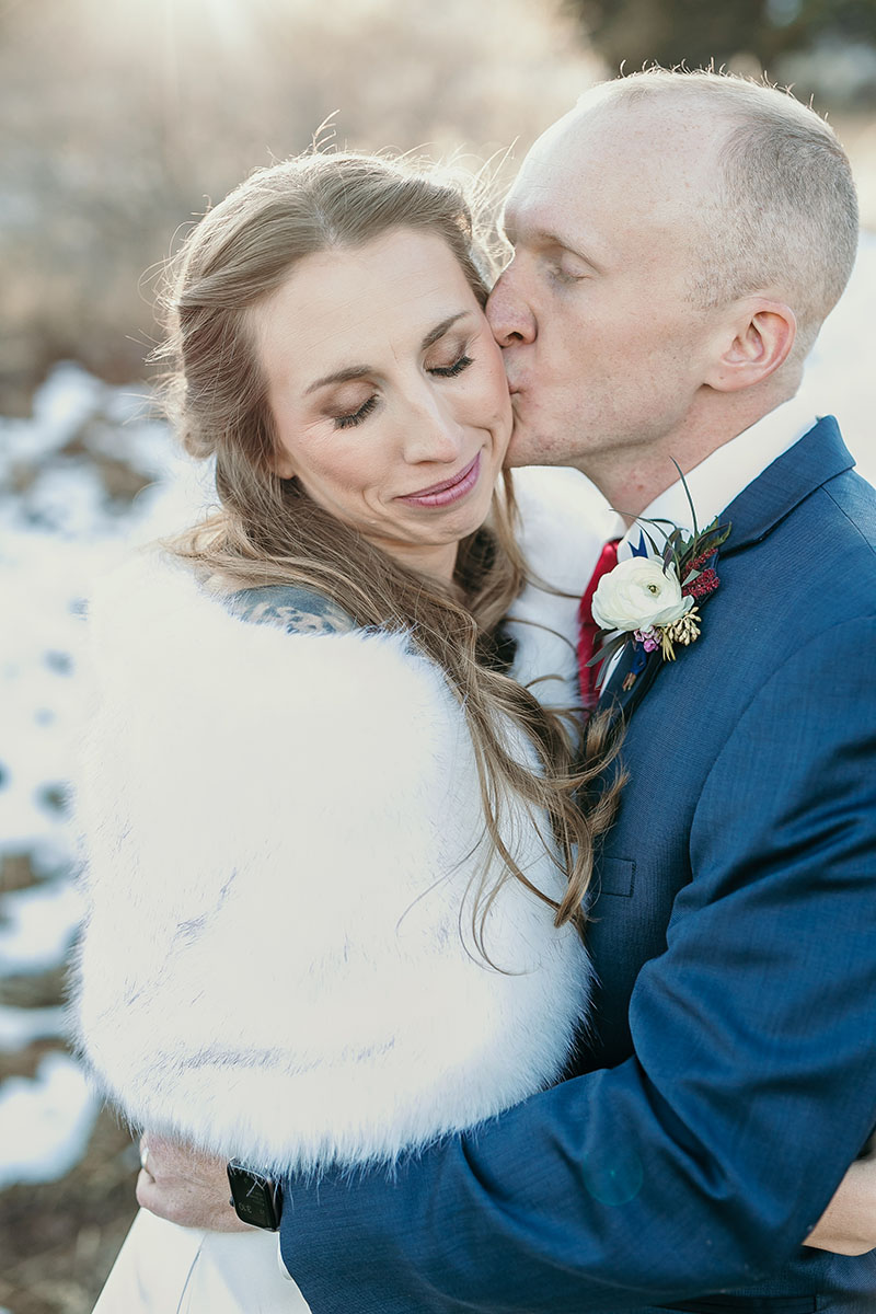 bride and groom portrait kissing
